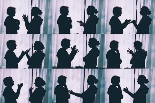 Nine photos taken of the same two people as they talk